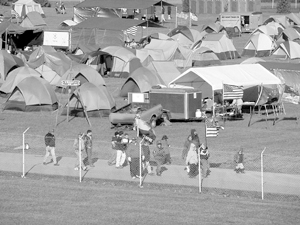 (Left) Scouts, Scouters and parents from Troop 38 sponsored by Calvary United Methodist Church, Waynedale showing off their new tents at the Council Camporee at The Kruse Auction Park in Auburn,  October 5-7, 2001.