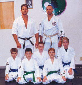 Kids Advanced Karate Class (Blue belts and Green belts) Sean Cossairt, Jackie Cossairt, Adrian Stark, Jordan Parisi, Andrew Habegger.  Standing: Dojo instructors, Jay Thompson (right) and Mike Belot (left).