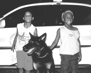 Canine “Zorro” enjoying the evening with Korey and Kameron Joyner during National Night Out.  Zorro’s handler is Officer Lowden.
