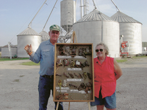 Paul Hardy and his wife, Pat will be displaying their collection of corn husking pegs at the Corn Husking Contest in Huntington on October 19 and 20. This special metal hook quickly tears away the husk, exposes the ear, which is then tossed into the wagon.