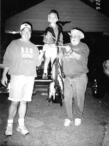 (L-R) Patrick McCune, Cole McCune, & our Associate Editor, Ray McCune with a string of Wabash River ‘Trout’ (carp) caught at Huntington Reservoir.
