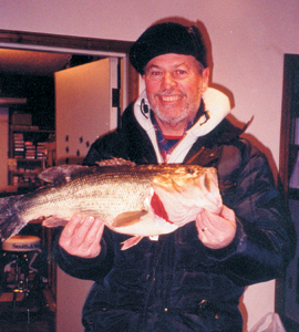 One evening in January, ice fishing on the Wabash River, Jim Crow of Bluffton landed this 6lbs. 10oz. largemouth bass. It was caught on a 1-lbs test line tipped with dough ball. Assisting on the landing of this bass was Jim DeHoff. Truth be told..it was caught on a local farm pond north of Bluffton with Jim’s special handmade “Crow Fly” (sold exclusively at The Bluffton Gun Shop, Bluffton). Barney from The Bluffton Gun Shop said he thinks this bass could actually turn his head and sing!