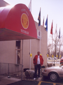 Commander Charlie Rathsack of American Legion Post 241 stands in front of the newly applied yellow ribbons which are placed in support of and in hopes of a safe return of our troops in Kuwait.