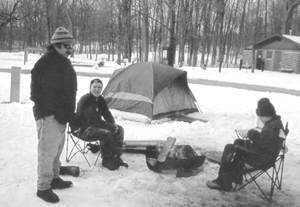 “Keeping the fire warm!”                                                                Photo by Gary McOmber (L to R)  Troop 344 Scoutmaster Bob Rainwaters & Boy Scouts Joe Jarvis and Karl McOmber