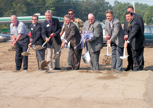 photo by Cindy Cornwell Three Rivers Federal Credit Union breaks ground for their 19th branch.  Plans are to open in December 2003. (Front: l-r) Ken Gerke Three Rivers Board of Director, Scott Taylor Chamber of Commerce, Tom Hayhurst Fourth District City Councilman, Mayor Graham Richard, Three Rivers President/CEO Jim Mills, Rick Bender South Side Business Group President, and Mike Romary President MER Group. (Back: l-r) Jeff Hile MSKTD Company and Mike Kinder K & H.