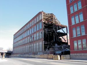 Looking northeast from Broadway, Dec 2, 2003, as Building 17 (built in 1911) goes by way of the wrecking ball.  
