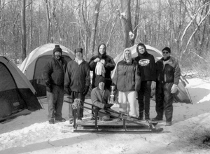 Troop 344’s Victorious 2004 Klondike Derby Team (L - R) Scoutmaster Bob Rainwaters, Scouts Karl McOmber, Joe Wilder, Joe Baumgardner, Zach Firestone, and Assistant Scoutmaster Gary McOmber.  Sitting - Scout Randy Brautsch with 1st Place Trophy 