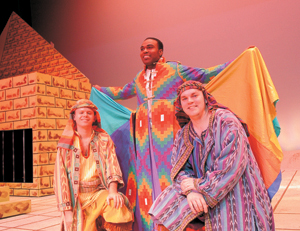 (kneeling l-r) Cast members Nathan Smith and Kerry Yingling. Standing in the coat of many colors is Kontrell Tyler from the Civic Theatre production Joseph and the Amazing Technicolor Coat. Don’t miss this family musical.