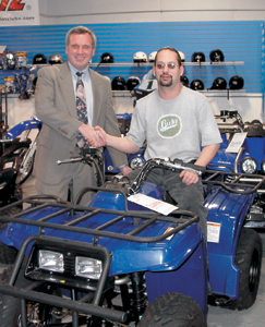 (L-R) are Jeff Krivacs, Waynedale branch manager of Tower Bank & Trust Company and Mark Derloshon at Fort Wayne Yamaha on Engle Road.