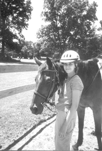 Horseman Julia Shepard from Girl Scout Troop #850 enjoyed lessons and trail riding at Camp Logan this year.