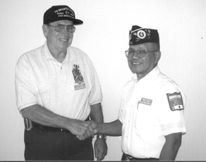 Pictured is medal recipient Paul Kiger on the left, being congratulated by Korean War Veteran Quiet Warrior Chapter President Marcos Botas.  Mr. Kiger served in Korea as a medic in the Twenty-fifth Infantry Division during 1958 and 1959.