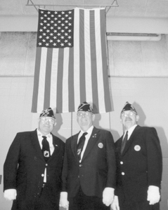 Standing with the American Flag above them are: (l-r) Gerald Lloyd (Marines 1948-1952), Charlie Walter (Army-Europe 1942-1946, Larry Byers (Army National Guard 1962-1966) from American Legion Post #241, Bluffton Road.