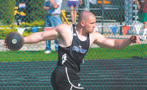 photo by Bill Scott Adam Longsworth, 2003 Elmhurst Grad, throwing the discus at the Taylor Invitational in mid-April for the University of St. Francis.