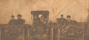 Published in the Fort Wayne Sentinel-?circa. The caption read: According to R. A. Prince, 2708 Lower Huntington Road, these were some of the first cars in Fort Wayne. His grandparents, George and Katharine Mason are on the right.
