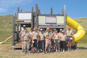 photos by Bill Reiman and Tom Watson Aldersgate United Methodist Church Boy Scout Troop 349 pose in front of the Bear Creek Playground that they helped to restore.