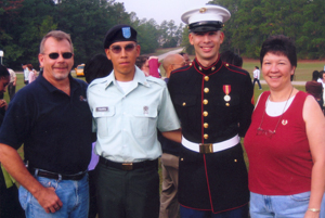 (l-r) Mike Fry (stepfather), PFC Jason D. Ybarra, Lance Corporal Robert J. Ybarra (brother), and Judy K. Fry (mother).