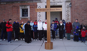 photo by Corissa Baker The Jubilee Pilgrim Cross traveled downtown to the abortion clinic on February 9, 2006 where students from Bishop Luers and Bishop Dwenger High Schools as well as St. Therese Catholic School and Father Joe Rulli peacefully prayed for the women and their babies.