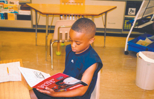 Devante Jones working on his “Summer Voyage”material at Waynedale Elementary School