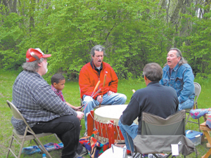 The Painted Turtle Drum & Singers presented traditional drumming songs on Saturday, May 5, 2007 opening a new season of programs at the Chief Richardville House. (Clockwise) Red jacket George Strack, Jay Hartleroad, Gary Shoemaker, George Marks, Chase Conrad.