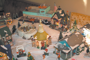 Each November, Myrtle Young and her family gather to assemble a Christmas Village. Pictured on display is just a hint of the many villages that she has acquired over the years of collecting.  Myrtle’s Christmas Village is much like her circle of friends she said, “Some are funny, some are sentimental, some she has had for many years, some are new, and all are very special.” Watch for an upcoming article on Myrtle Young-The Potato Chip Lady. 