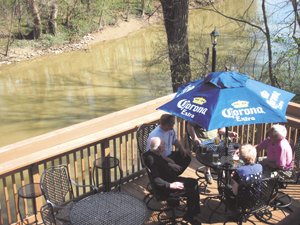 Enjoying the newly completed deck at Curly’s Village Inn 40-year veteran Mary Armstrong, Irishman Dudley O’Carroll, Billy the Plumber, Dave Meyers, and Mr. Bible-King of Swizzle. 