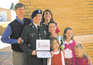U.S. Army photo by John Crosby Pvt. First Class Scott Mix proudly holds his newly earned high school diploma with smiling family members at the Patriot Academy’s first graduating class graduation ceremony at the Muscatatuck Urban Training Center in Butlerville, Indiana, March 18. Fort Wayne’s Mix decided to join the Patriot Academy to earn his diploma and serve his country. The Patriot Academy is the U.S. military’s first ever accredited high school.