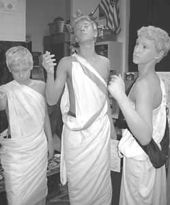 Eighth graders Matthew Paris, Noah Johnson and Alex Maldeney looking remarkably like Greek statues.