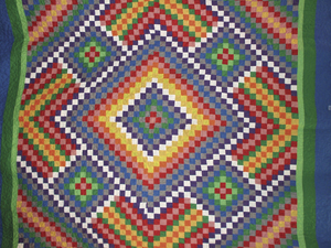 Bold Beautiful and geometric, this quilt is a version of “Trip Around the World” of “Postage Stamp”.Bold Beautiful and geometric, this quilt is a version of “Trip Around the World” of “Postage Stamp”.