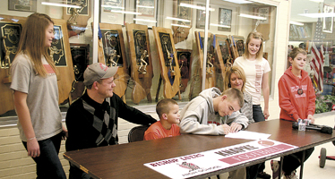 On National Signing Day, Wednesday, February 1, 2012 James Knapke put his pen to the paper and inked to Bowling Green State University. James is surrounded by his family-parents Jim and Roselyn, brothers and sisters Jonathan, Kayla, Katherine, Norman and Nelson.