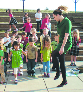 Nikki Taylor shows students some Irish dance steps.
