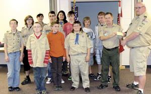Check presentation from Walt Pressler to Matt Johnson, Scoutmaster Troop #344 with members of the Troop present at the meeting, Tuesday, April 10, 2012. 