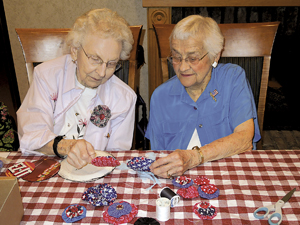 Jean Keuneke and Norma VonGunten discuss the next step of the Yo-Yo’s they are making at Kingston Residence.