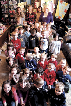 St. Joe-St. Elizabeth preschool students at Fabric and Friends Shop. In the back row are shop owners Deb and Stacey Roehm, Preschool Teacher Sharen Gall and Preschool Aide Lanette Gallagher.