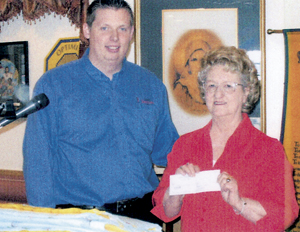 Jon Perkins of the the Southside Optimist Club presents $100 donation to Nana’s Creations
