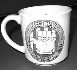 A vintage 1980’s official lefty mug is designed to have a disastrous result if a “righty” attempts to drink from it.