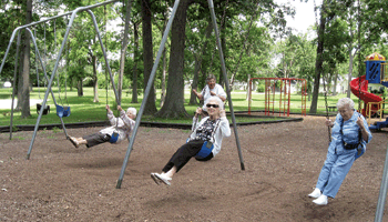 Residents of Kingston Residence on Winchester Road (left to right) Ginny Hambel, Margaret Keyser, Donna Ross, Delight Musselman all enjoy the swings during a picnic luncheon at Waynedale Memorial Park.