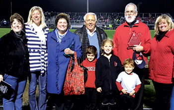 Distinguished Knight (left to right) Tiffany Albertson (Principal), Sarah Shank (Alumni Director), Becky Henry, Jerry Henry, Father Bill Sullivan and Melissa Hire (Alumni Director).