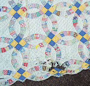 1940s double wedding ring family quilt finds a new home at Born Again Quilts.