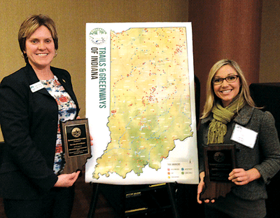 L-Dawn Ritchie, Director of Greenways and Trails, City of Fort Wayne and R-Lori Rose, Executive Director of Fort Wayne Trails Inc. accept award for City’s Trails and Greenways as Outstanding Trail Group.