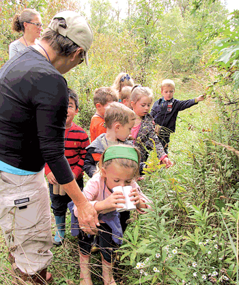 On September 29, the 4-year-old preschoolers of Mrs. Sharen Gall and Mrs. Molly Schwartz took part in a field trip to Eagle Marsh nature preserve off of Engle Road. The students pulled on rain boots and walked on the muddy hiking trails. There they saw wildflowers, milkweed plants, turkey foot grasses, cattails and a crayfish “castle,” or mound of mud above the crayfish underground home. While a red-tailed hawk soared overhead, the preschoolers saw insects, heard crickets and found the feathers and bones of an unfortunate goose who had been preyed upon in the nature preserve.